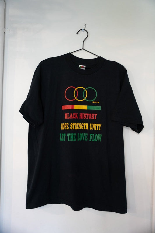 Black vintage Black History Let the Love Flow t-shirt with red gold green interlocking circles tricolor bar HOPE STRENGTH UNITY and green lettering size XL