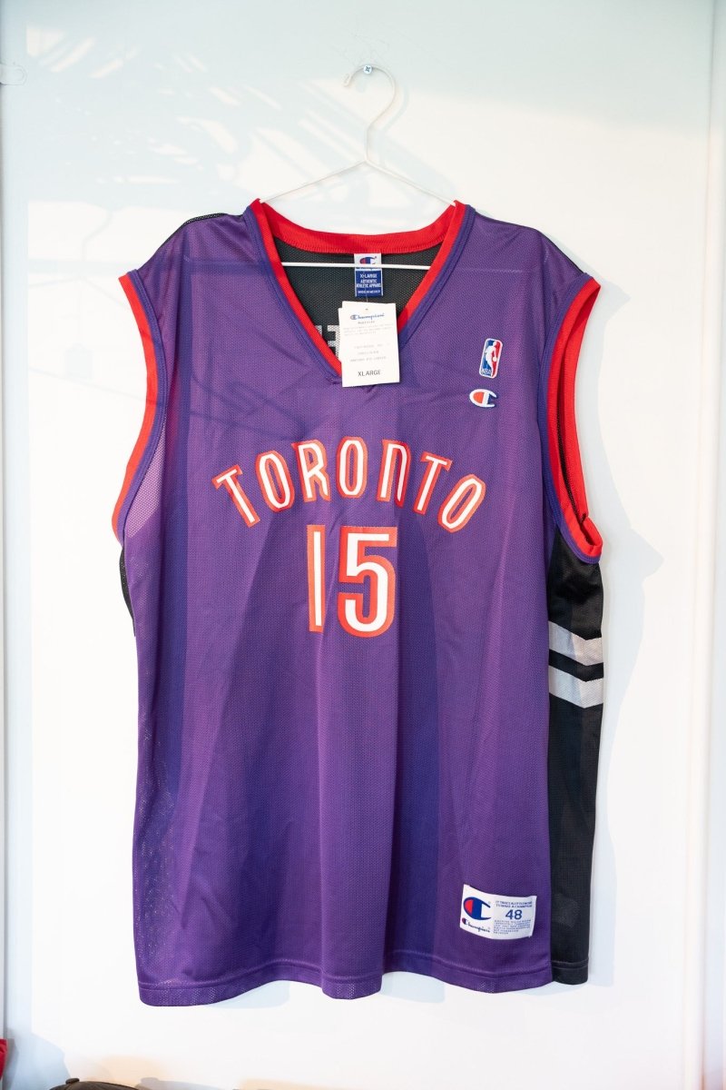Purple vintage Champion Toronto Raptors Vince Carter 15 basketball jersey red TORONTO text black silver stripes original tags deadstock size XL 48