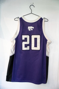 Colosseum Athletics Kansas State College basketball jersey in large size, featuring purple fabric with printed athletic graphics and team lettering