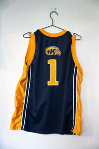 Colosseum Athletics Kent State basketball jersey in large size, featuring gold and black team colors with printed graphics on the front