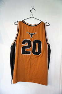 Colosseum Athletics University of Texas college basketball jersey in burnt orange, size XL, displayed on hanger