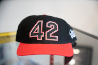 Black vintage Fila Jackie Robinson 42 snapback hat with large embroidered 42 in black with red outline and red brim