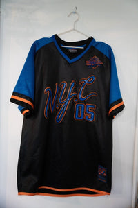Black vintage FUBU NYC 05 mesh jersey with royal blue sleeves large blue orange NYC script lettering 05 number and FUBU City Series patch size XL