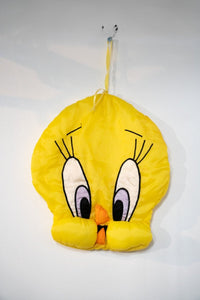 Yellow vintage Looney Tunes Tweety Bird shaped pillow with large eyes and orange beak, sold without cotton stuffing