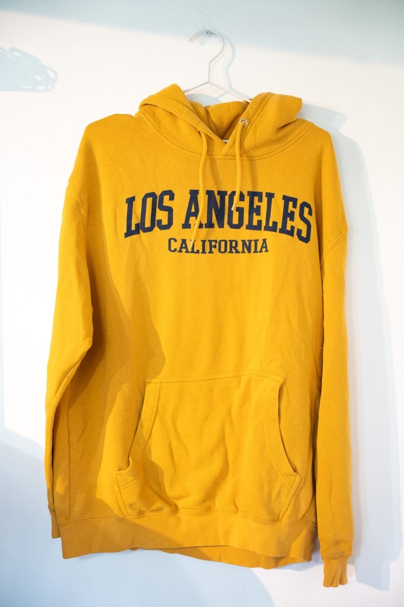 Gold mustard yellow Los Angeles California pullover hoodie with navy blue LOS ANGELES CALIFORNIA block lettering drawstring hood kangaroo pocket size XL