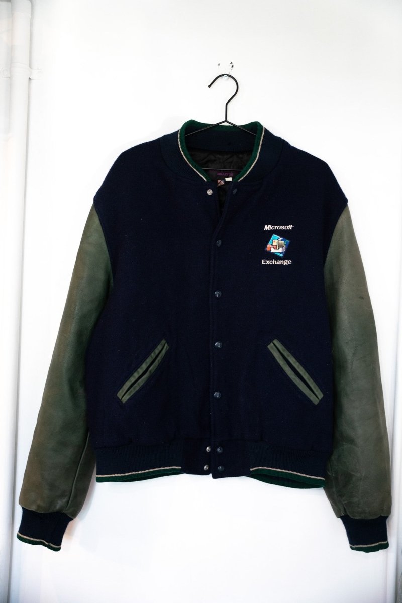 Vintage Microsoft Exchange employee letterman jacket with navy wool body dark green leather sleeves and embroidered Microsoft Exchange logo size L