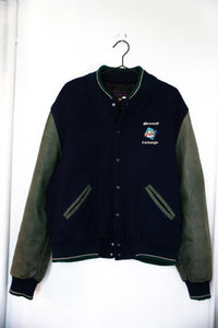 Vintage Microsoft Exchange employee letterman jacket with navy wool body dark green leather sleeves and embroidered Microsoft Exchange logo size L