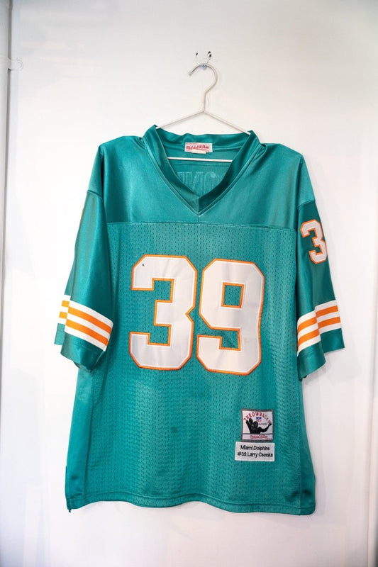 Mitchell & Ness throwback Miami Dolphins #39 football jersey in aqua and orange, size medium, displayed flat showing front chest logo and number placement