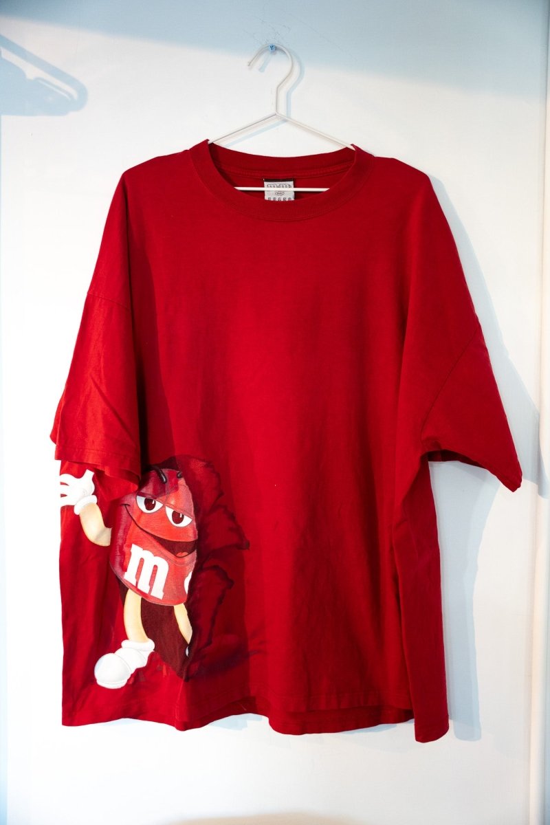 Red vintage M&M World Las Vegas tee with Red M&M character mascot at lower left corner white m logo white gloves sneakers size XXL