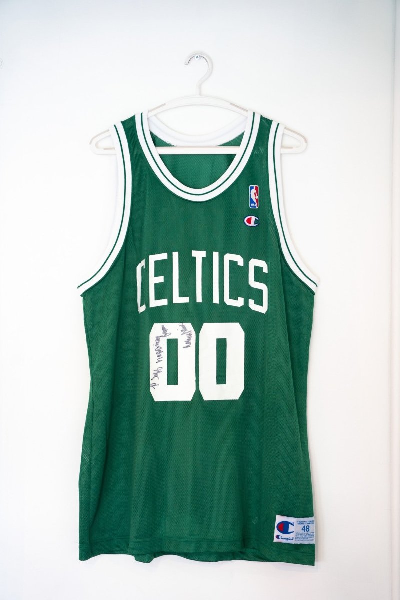Green vintage Champion Boston Celtics Robert Parish 00 autographed jersey white text NBA logo patch signed inscription size 48 XL