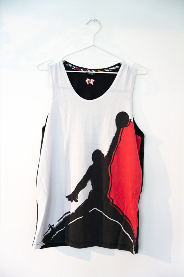 White vintage Nike Air Jordan 7 OG tank top oversized black Jumpman silhouette red accent tribal pattern neckline trim black side panels size Large