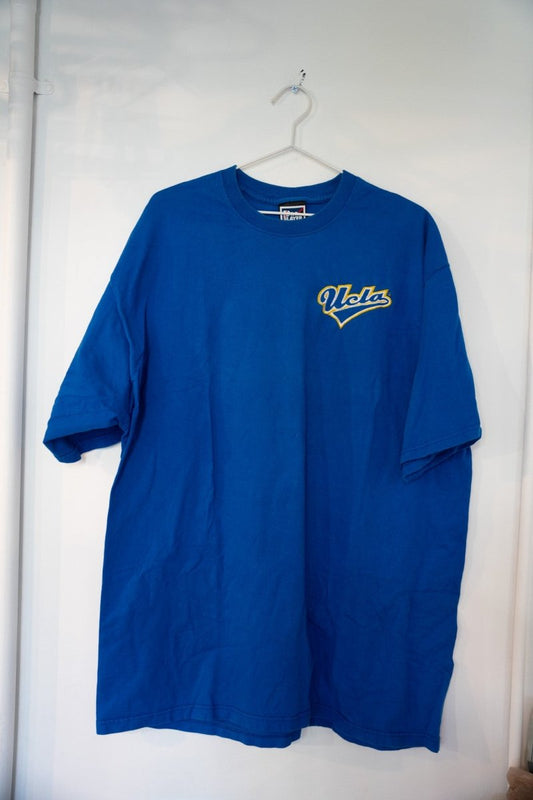 Royal blue vintage Pro Player UCLA embroidered t-shirt with gold outlined cursive UCLA script logo on left chest size XXL
