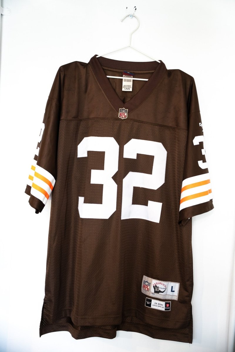 Brown vintage Reebok Cleveland Browns Jim Brown number 32 NFL Throwbacks jersey with white numbers and orange white sleeve stripes size Large
