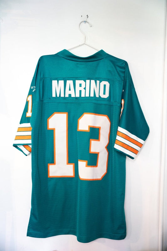 Reebok Miami Dolphins #13 football jersey in aqua and orange, size medium, displayed flat showing front panel with team logo and player number