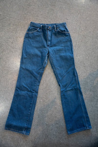 Medium wash vintage Rustler denim jeans straight leg five pocket copper rivets high rise zip fly W32 L32