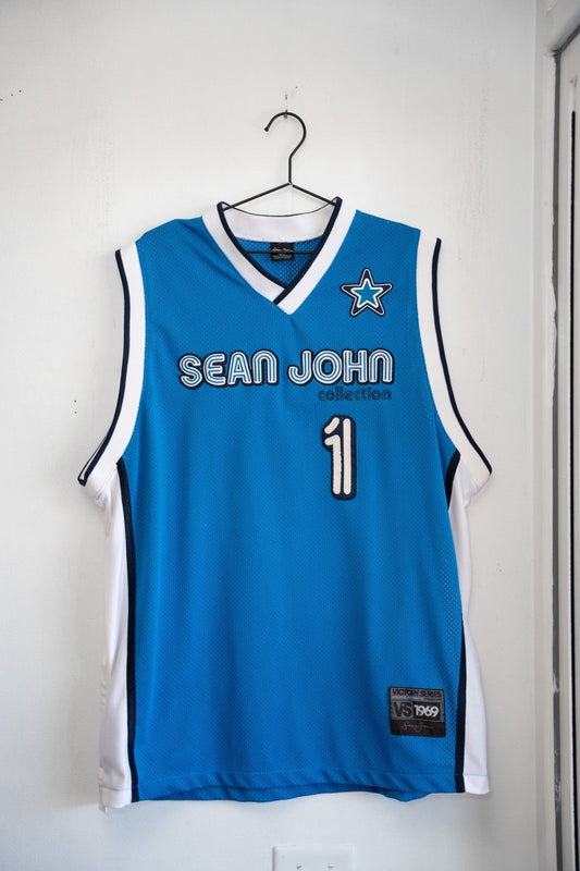 Blue vintage Sean John Collection basketball jersey mesh body SEAN JOHN blue outlined text number 1 star logo navy white V-neck trim