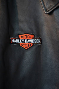 Harley-Davidson Snap-On racing leather jacket in black with visible snaps and hardware, size XXL displayed flat