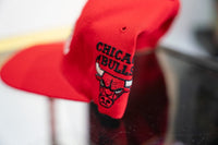 Starter Chicago Bulls red baseball cap with embroidered logo and adjustable back closure, vintage 1990s sportswear