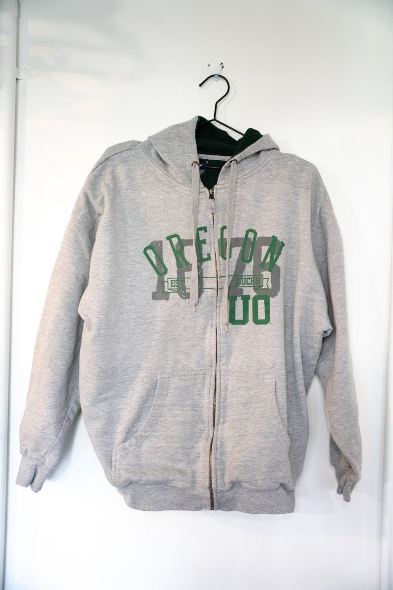 Heather gray vintage TSI Oregon Ducks full-zip hoodie with green OREGON lettering and faded 1876 graphic with dark green hood lining