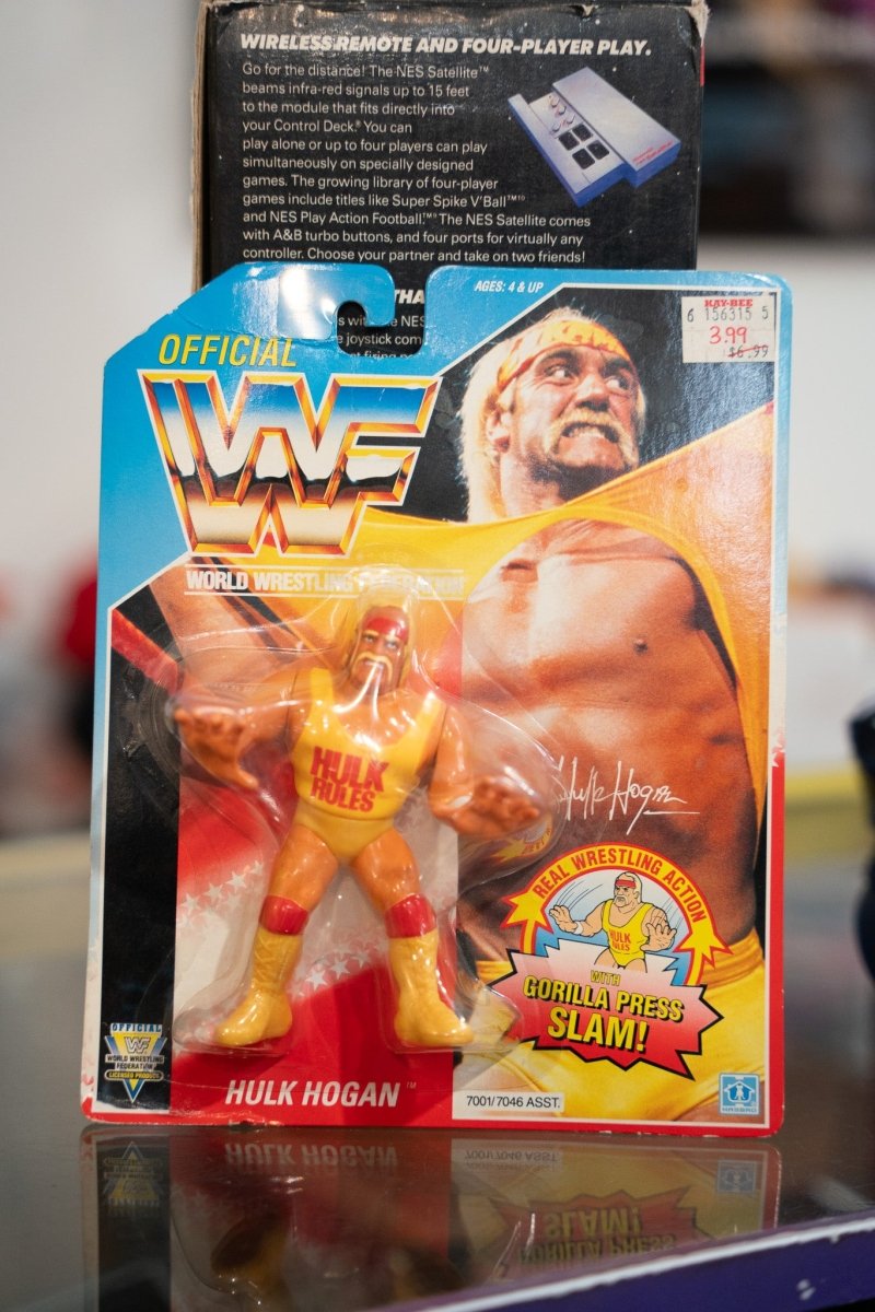 Vintage WWF Hulk Hogan 1990 Hasbro action figure sealed on red card in yellow Hulk Rules shirt with Gorilla Press Slam and Kay-Bee sticker