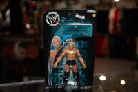 WWE Backlash Series 12 action figure with blonde hair wearing black and silver wrestling attire with microphone prop, circa 2007