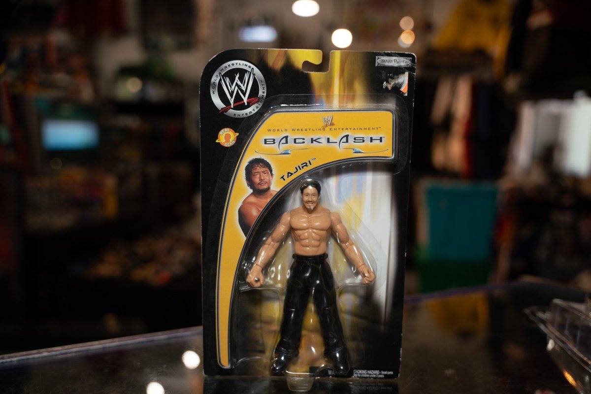 WWE Backlash Tajiri action figure with black hair, white face paint, and black wrestling attire with Asian-inspired designs
