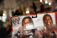 WWE Battle Pack featuring Kofi Kingston and R-Truth action figures with articulated limbs and detailed wrestling attire