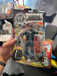 WWE Ruthless Aggression Eric Bischoff action figure with detailed sculpting and articulated joints, circa 2000s wrestling collectible