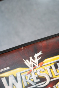 WWF WrestleMania 15 black metal folding chair with white logo text printed on seat, event merchandise from 1999