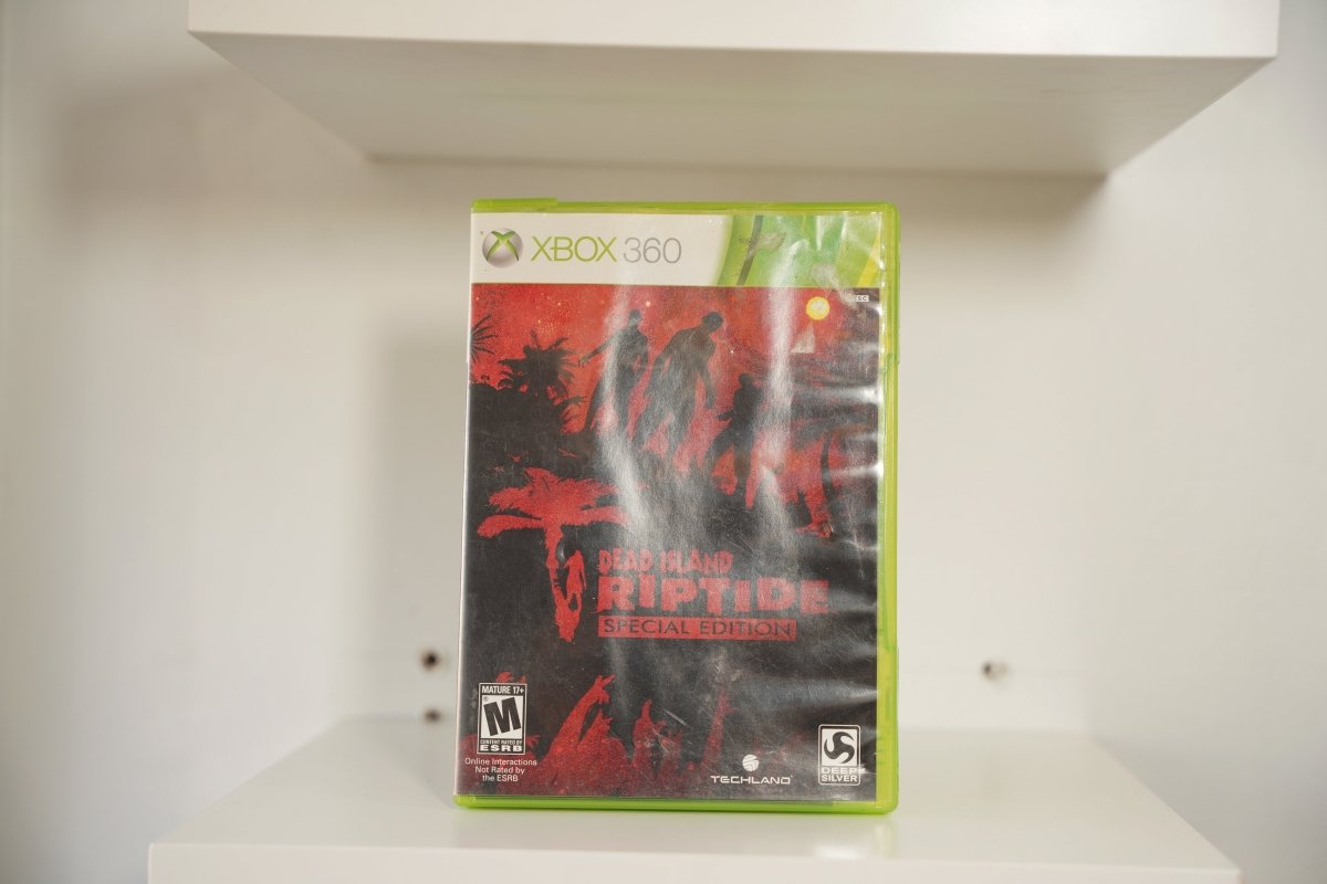 Xbox 360 Dead Island Riptide Special Edition case zombie silhouettes red sky palm trees DEAD ISLAND RIPTIDE red text Techland Deep Silver Mature