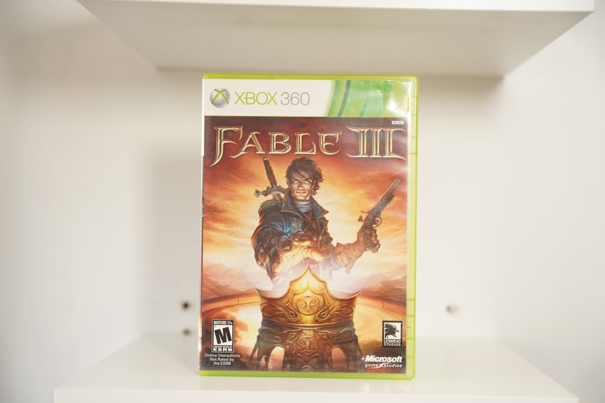 Xbox 360 Fable III case hero sword pistol golden throne fiery sky FABLE III serif text Lionhead Studios Microsoft Mature
