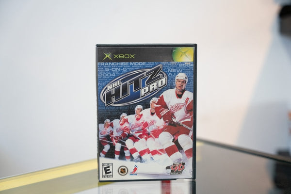 Xbox NHL Hitz Pro game case Detroit Red Wings white jerseys ice hockey action NHL HITZ PRO blue metallic logo Midway Sports Nicklas Lidstrom