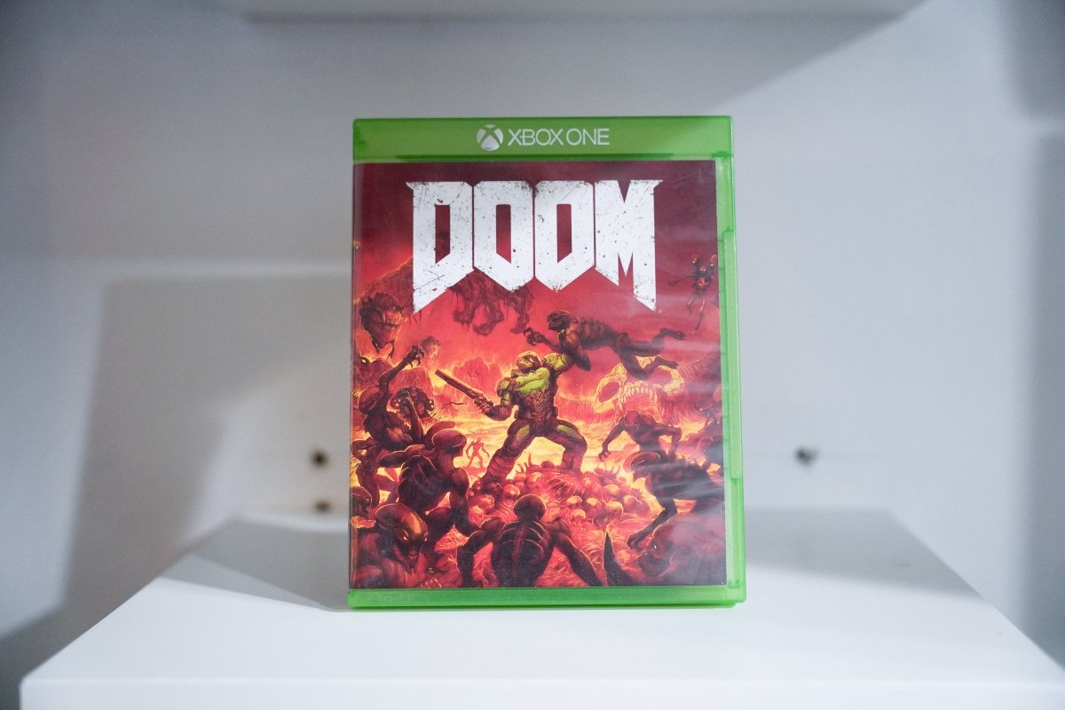 Xbox One DOOM case Doom Slayer green armor demons hellscape fire DOOM white distressed text red orange background