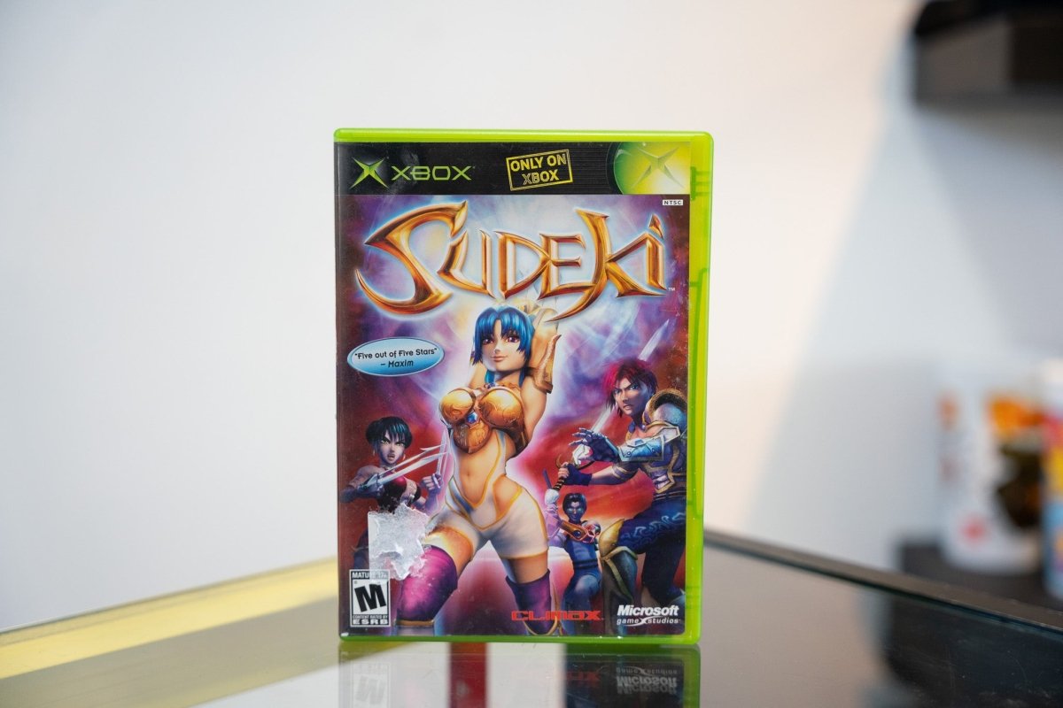 Xbox Sudeki game case 2004 Climax Studios four fantasy characters golden armor blue hair purple background gold title text Only on Xbox